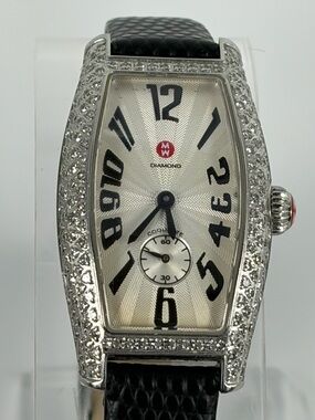 Genuine Michele Coquette ladies’ tonneau watch with diamond bezel and lugs.